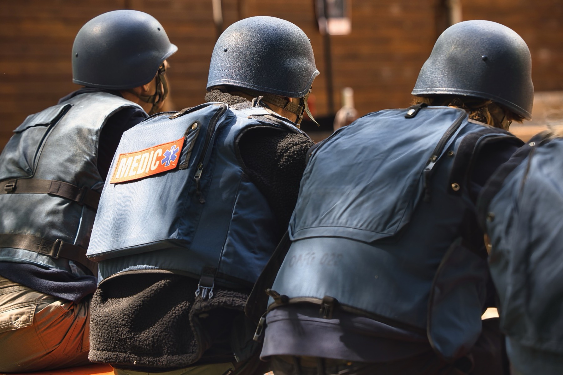 Medic team seen from behind in training formation