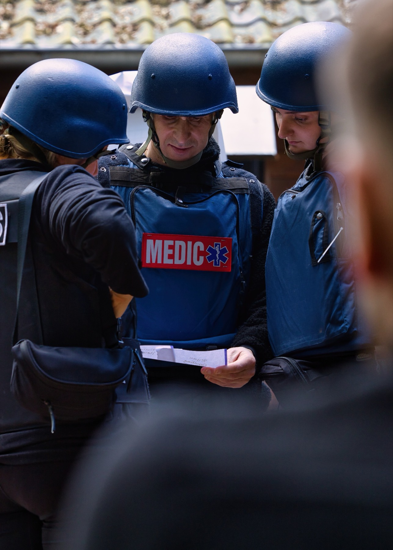 Medic team reviewing notes during exercise