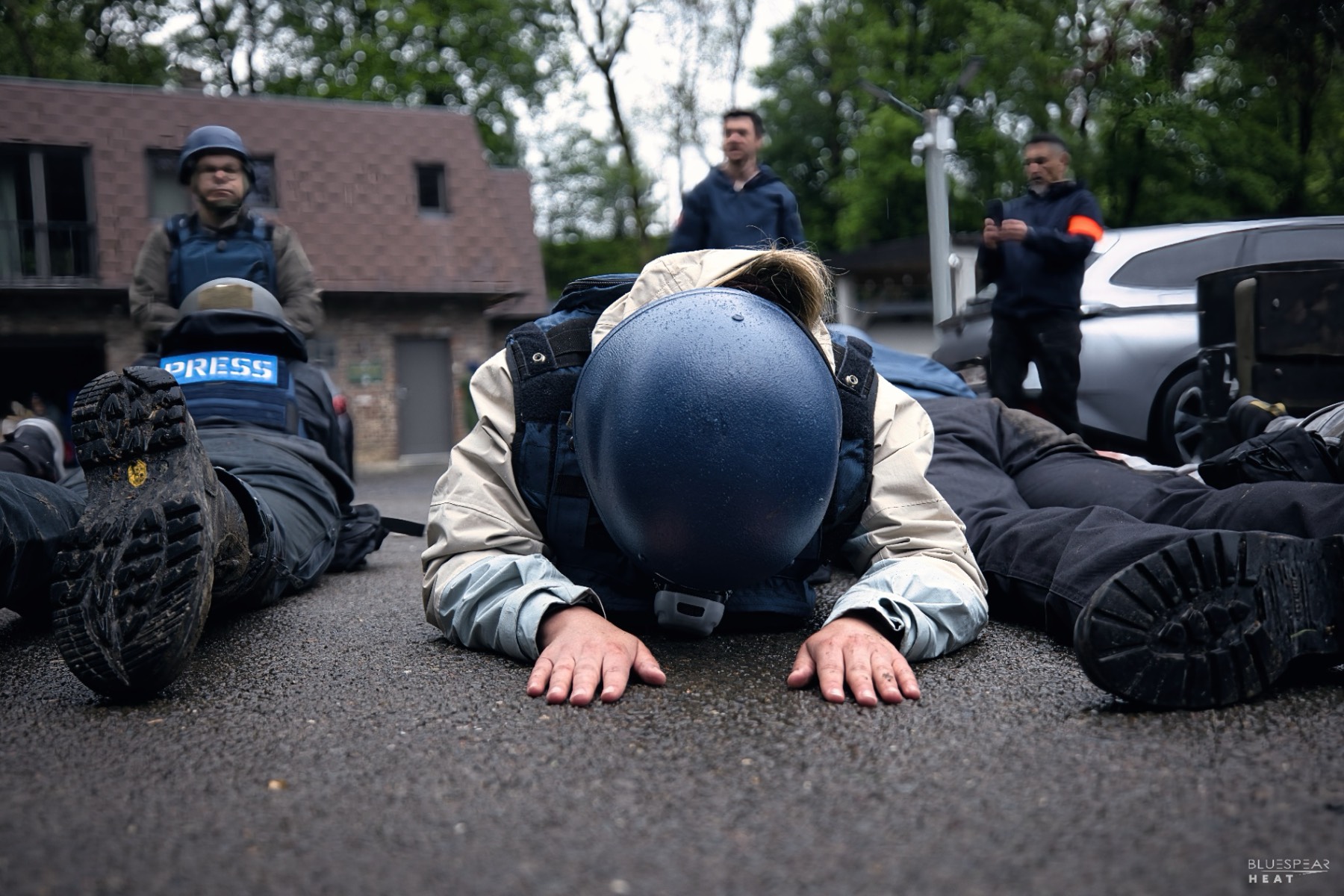 Take-cover drill on wet pavement