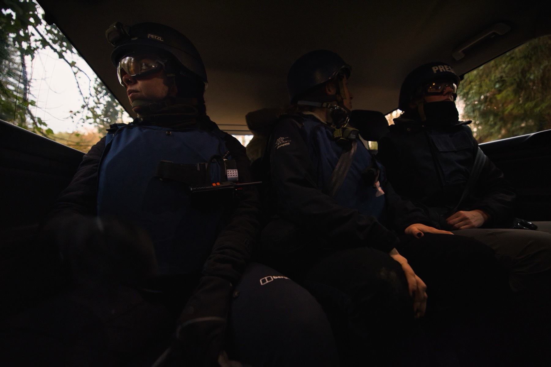 Press team riding in armored vehicle